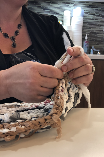 M. Holland Company Making Plarn Mats Fo Homeless