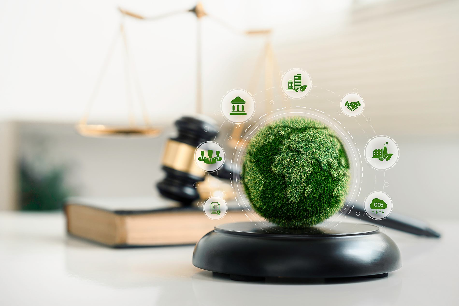 Green textured globe surrounded by sustainability icons in front of a gavel and scales of justice, symbolizing how PCR laws are shaping regulatory requirements for plastic packaging and products.
